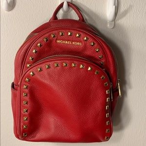 Michael Kors red backpack with studs